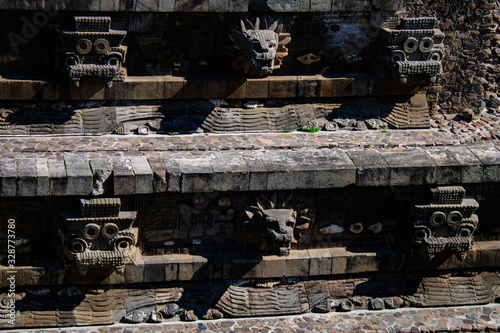 Mexican ancient historic sculptures in Quetzalcoatl temple at Teotihuacan, Mexico photo