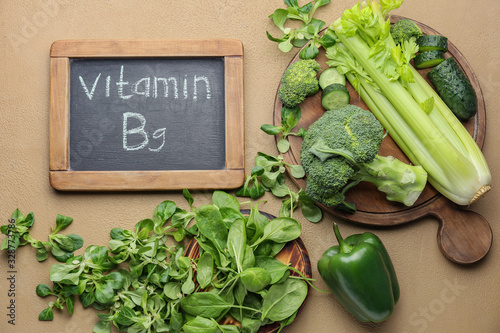 Cuadro en lienzo Healthy products rich in vitamin B9 on color background