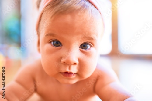 Adorable baby lying down on the sofa at home. Newborn relaxing and resting comfortable