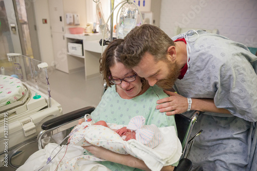 Parents holding nicu baby