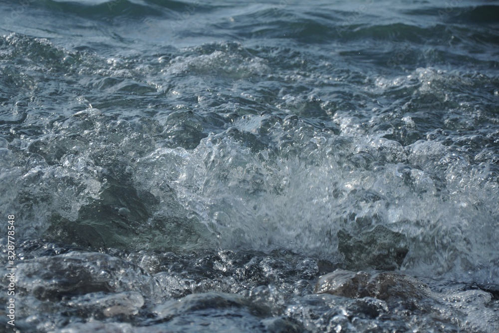 Fototapeta premium Dark sea wave and foam running ashore