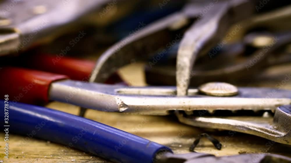 Camera dollies across old and grimy tools in a toolbox. Camera dollies across old and grimy tools in a toolbox.