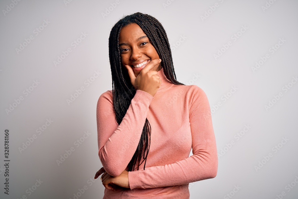 Young african american woman standing casual and cool over white isolated background looking confident at the camera smiling with crossed arms and hand raised on chin. Thinking positive. Young african american woman standing casual and cool over white isolated background looking confident at the camera smiling with crossed arms and hand raised on chin. Thinking positive.