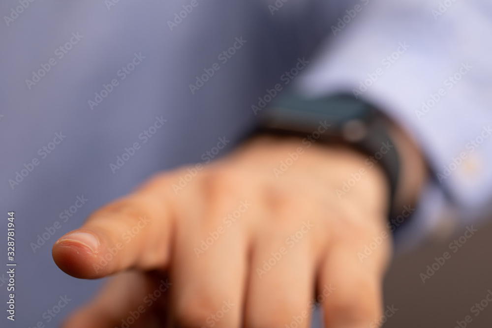 Close up of Businessman's hand looking at hand watch