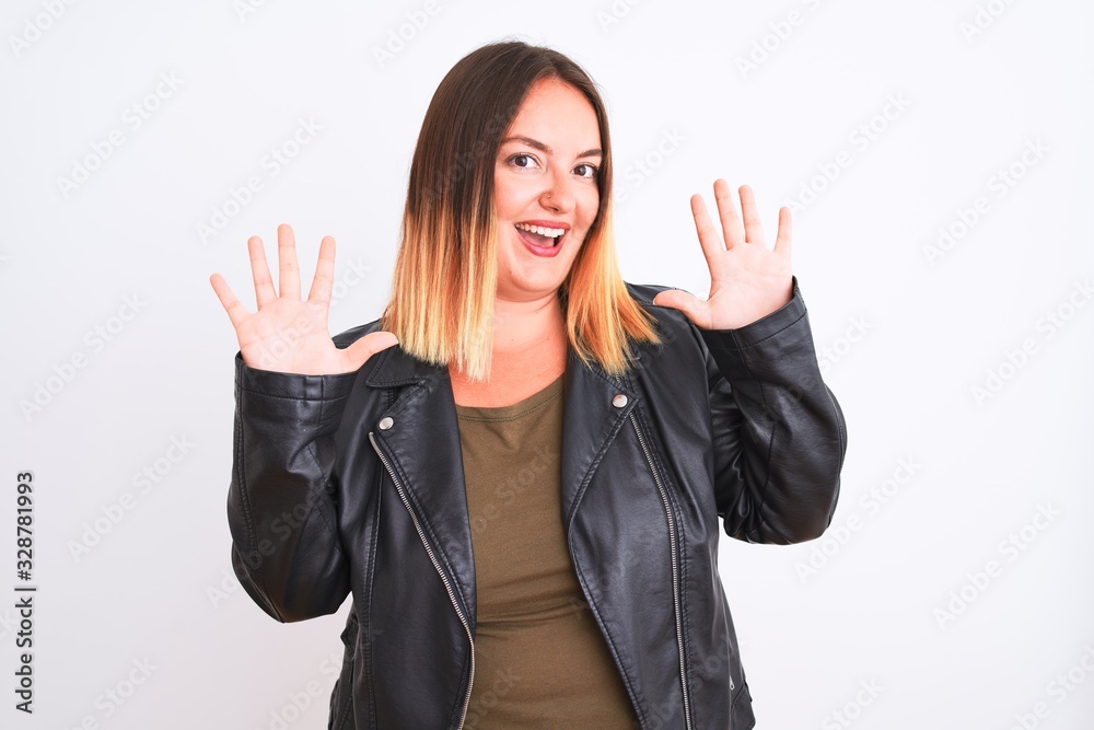 Young beautiful woman wearing t-shirt and jacket standing over isolated white background showing and pointing up with fingers number ten while smiling confident and happy.