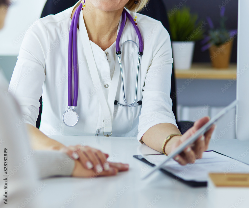 doctor explaining diagnosis to her female patient doctor explaining diagnosis to her female patient