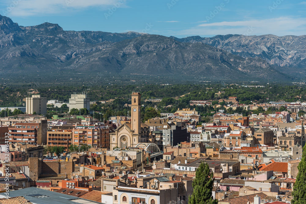 View of city buildings on a background of mountains, Tortosa, Catalonia, Tarragona, Spain.