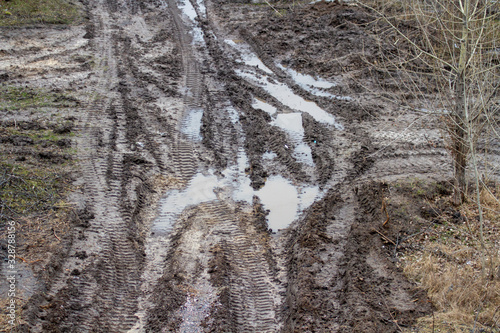 Tracks after rain, mud and roadless.