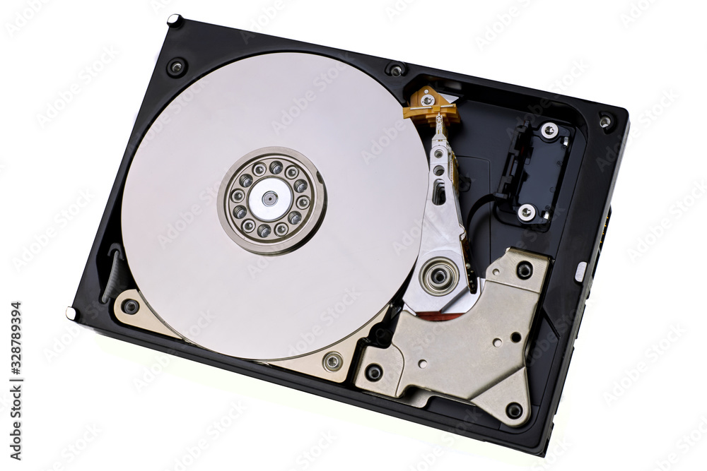 Hard disk drive isolated on white background. A computer's HDD data storage without protective cover, show the magnetic disk and electronic components inside the device. Hard disk drive isolated on white background. A computer's HDD data storage without protective cover, show the magnetic disk and electronic components inside the device.