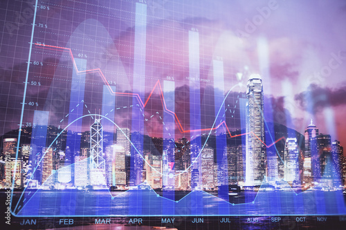 Double exposure of forex chart drawings over cityscape background. Concept of success.