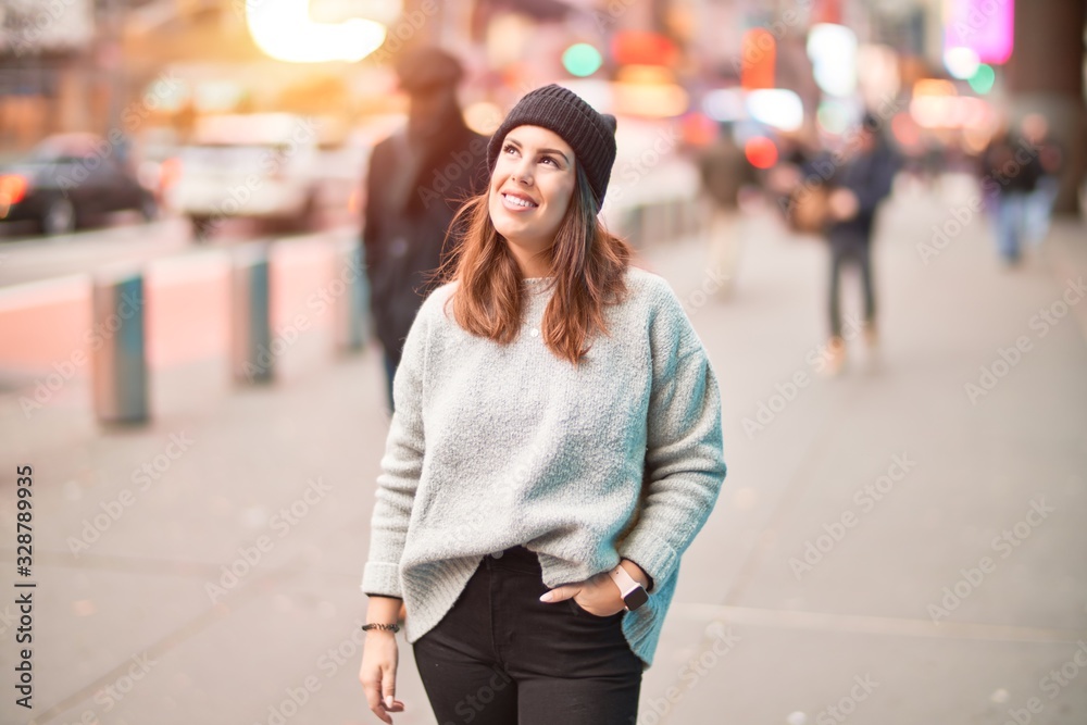 Young beautiful woman smiling happy and confident. Standing with smile on face walking at the city