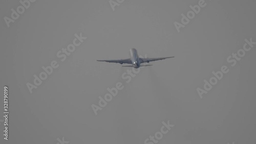 The take-off of a passenger plane from an airport lane photo