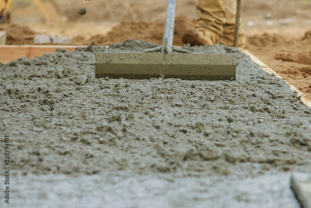 Cement pouring during sidewalk in new residential home - obrazy, fototapety, plakaty 