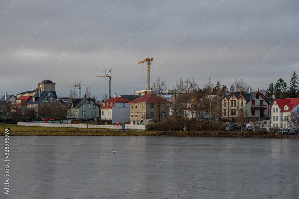 Buildings along Tjornin lake in Reykjavik Iceland