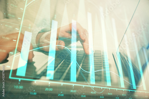 Wallpaper Mural Double exposure of market chart with man working on computer on background. Concept of financial analysis. Torontodigital.ca