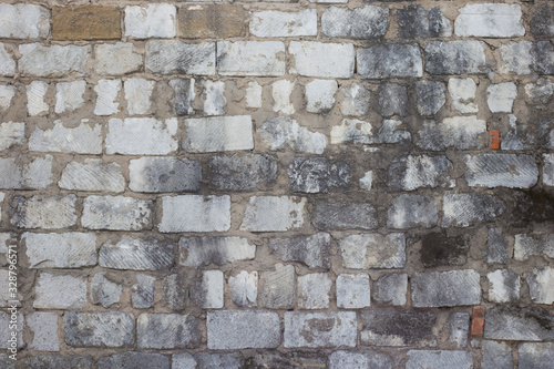 Old white stone wall with mold, horizontal texture. Dirty wall background