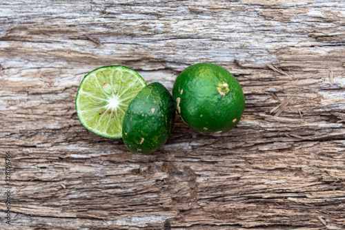 Fresh fruits of Citrus reticulata on aged wooden background photo