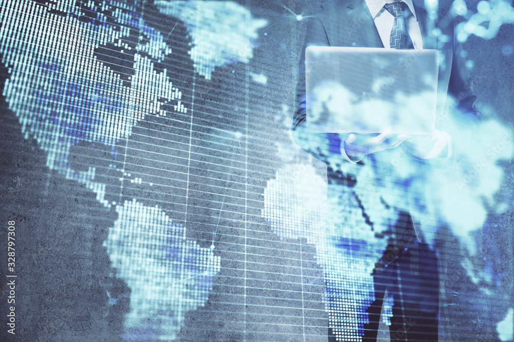 Double exposure of businessman working on laptop on background. International business hologram in front. Concept of success. Double exposure of businessman working on laptop on background. International business hologram in front. Concept of success.
