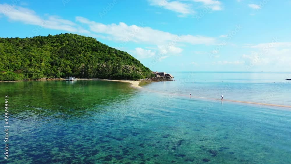 Beautiful seabed pattern with corals under calm clear water near shore of tropical island with lush vegetation Beautiful seabed pattern with corals under calm clear water near shore of tropical island with lush vegetation