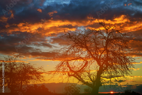 Dramatic bright sky at sunset over evening twilight sky.
