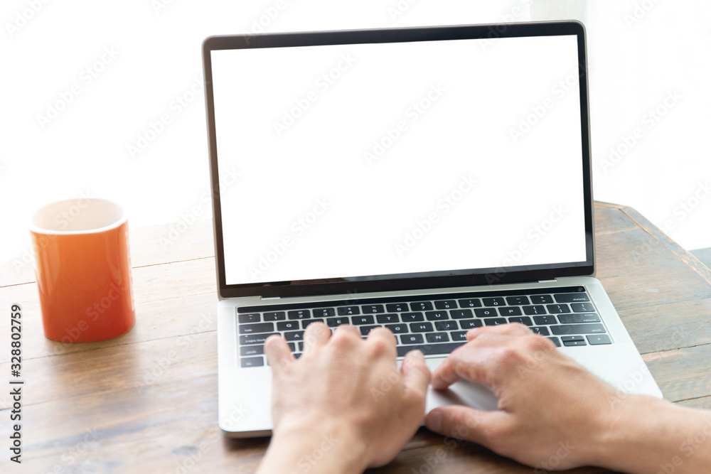 mockup image blank screen computer with white background for advertising text,hand man using laptop contact business search information on desk at coffee shop.marketing and creative design mockup image blank screen computer with white background for advertising text,hand man using laptop contact business search information on desk at coffee shop.marketing and creative design