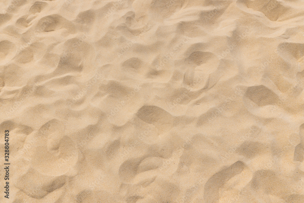Closeup shot of sand texture on the beach as background - obrazy, fototapety, plakaty 