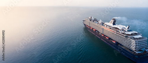 Aerial view of beautiful white and black cruise ship above luxury cruise in the ocean sea concept tourism travel on holiday take a vacation time on summer. forwarder mast