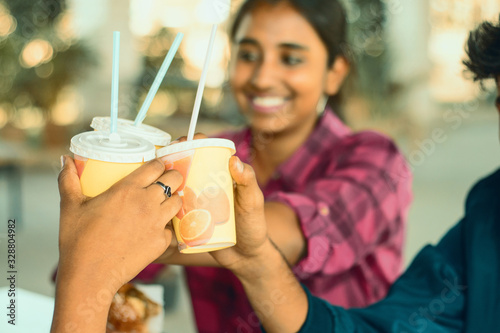 Canvas Print Selective focus on friends hands cheers Juice paper cups - Group of best Friends enjoying time or having fun at cafe, Best friendship concept - Young people having soft drinks at restaurant