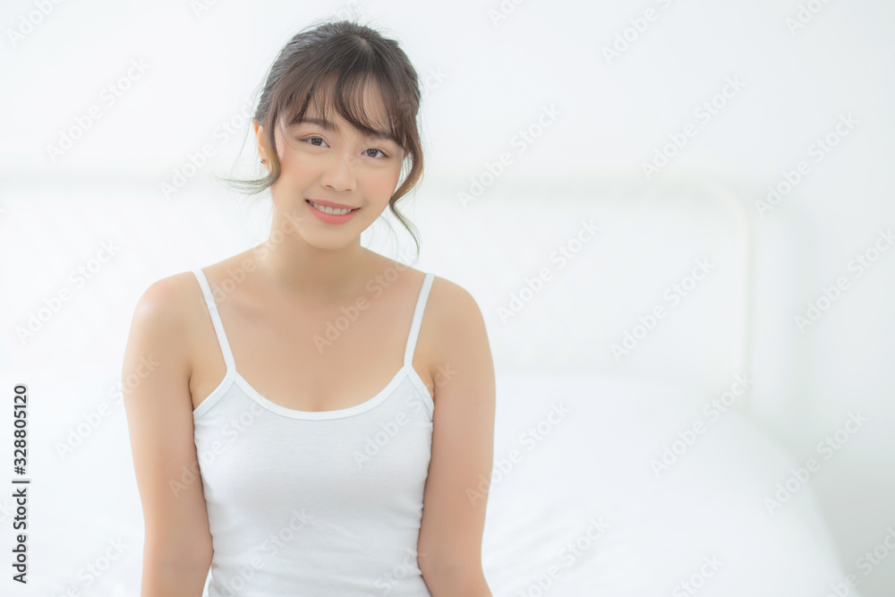Portrait of beautiful young asian woman makeup of cosmetic, girl happy and smile attractive, face of beauty perfect with wellness in the bedroom at home with skin care and healthcare concept. Portrait of beautiful young asian woman makeup of cosmetic, girl happy and smile attractive, face of beauty perfect with wellness in the bedroom at home with skin care and healthcare concept.