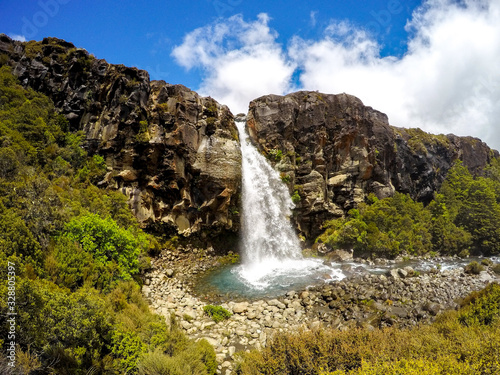 Taranaki waterfall at Taranaki Falls walking/hiking Trail in summer sunny day. Tongariro National Park, North Island, New Zealand © Dajahof