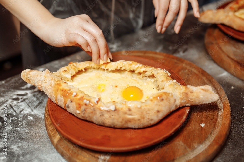 khachapuri with cheese during cooking