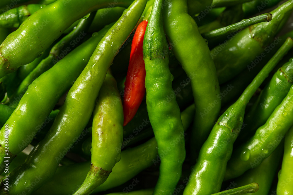 Close up of fresh green chili peppers texture Close up of fresh green chili peppers texture