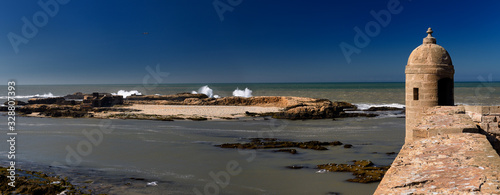 Small Essaouira Island with ancient ruins in the Atlantic Ocean from Sqala du Port fortress Panorama photo
