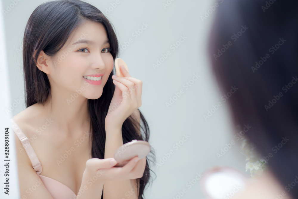 Closeup hand of young asian woman holding product cosmetic applying cream in jar, beautiful girl hand touch lotion for rejuvenation, beauty perfect, treatment and skin care and health concept. Closeup hand of young asian woman holding product cosmetic applying cream in jar, beautiful girl hand touch lotion for rejuvenation, beauty perfect, treatment and skin care and health concept.
