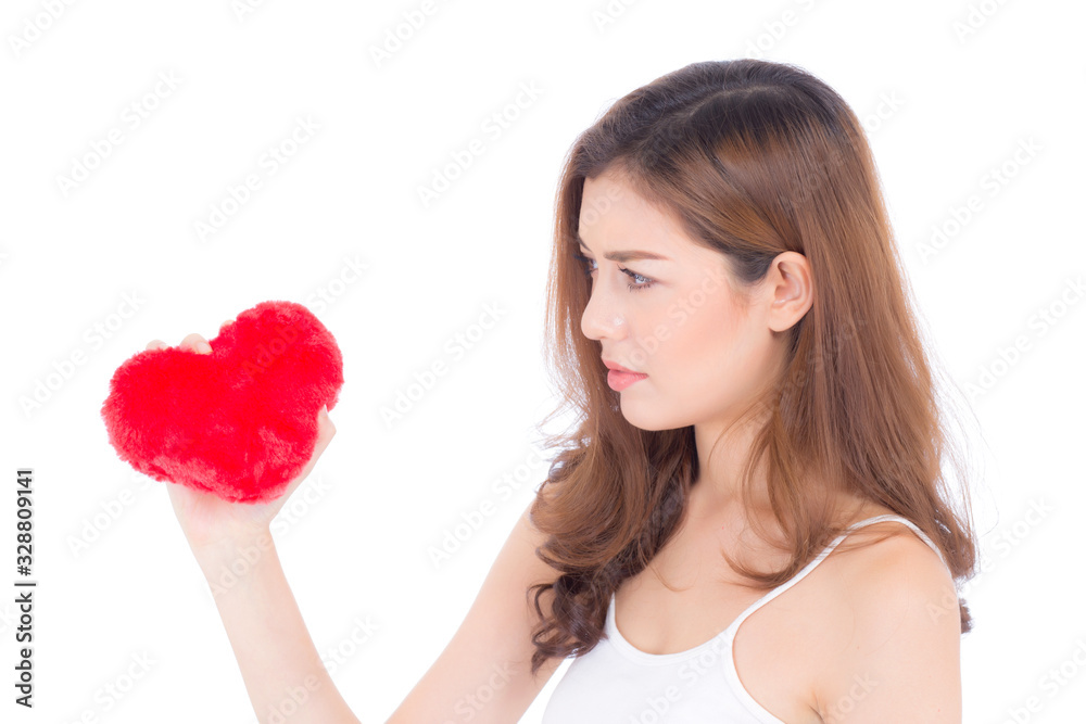 Portrait of beautiful asian young woman holding red heart shape pillow and smile isolated on white background, valentines day, holiday concept. Portrait of beautiful asian young woman holding red heart shape pillow and smile isolated on white background, valentines day, holiday concept.