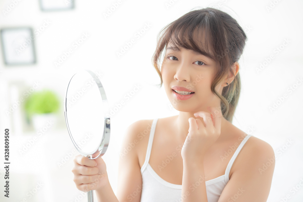Beautiful face young asian woman with happy smiling and looking mirror, makeup of beauty facial girl with skincare and cosmetic treatment, refresh of female and clean for charming, healthy concept. Beautiful face young asian woman with happy smiling and looking mirror, makeup of beauty facial girl with skincare and cosmetic treatment, refresh of female and clean for charming, healthy concept.