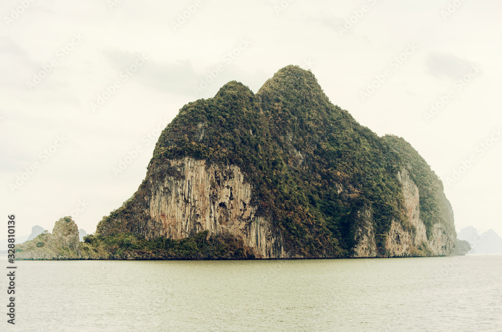 Thailand island with rock striations and vegetation