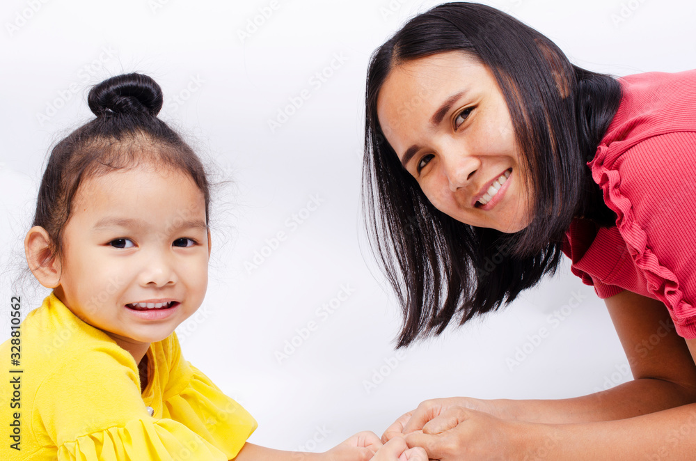 Asian Mother and cute baby girl portrait with smile on white backgrounds Asian Mother and cute baby girl portrait with smile on white backgrounds