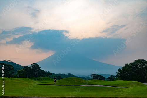 Sunrise view of the volcano called Agua, in Guatemala from a golf course called the Reunion destroyed by the volcano called Fuego in Central America.