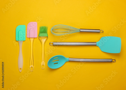 Flat lay compoisition of kitchen tools on yellow background. Minimalism. Top view photo