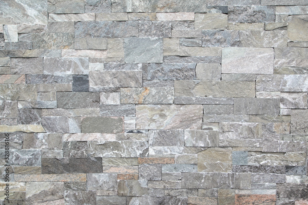 Fototapeta premium Gray stone wall closeup background photo texture