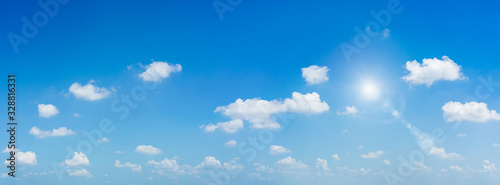 Panorama blue sky and clouds with sun and daylight natural background. © ParinPIX