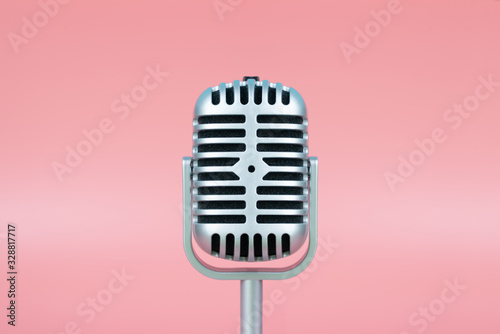 Retro microphone with copy space on pink background