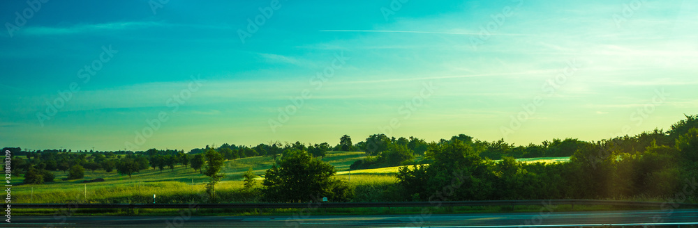 Obraz premium Germany, Frankfurt, Sunrise, a rainbow over a body of water