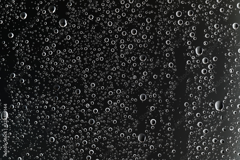 black wet background / raindrops for overlaying on window, concept of autumn weather, background of drops of water rain on glass transparent black wet background / raindrops for overlaying on window, concept of autumn weather, background of drops of water rain on glass transparent
