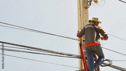 Technician connecting to the internet transmission line.