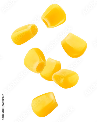 Leinwand Poster Falling corn seeds isolated on white background, clipping path, full depth of fi
