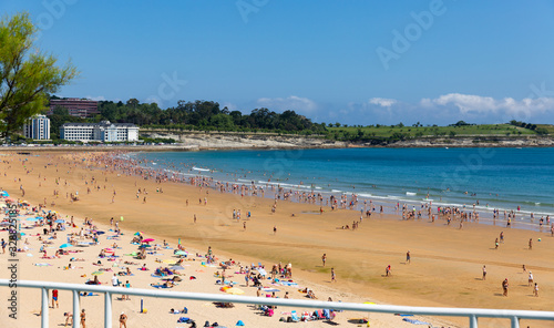 Santander, Spain - July 14, 2019: Crowded beach in Santander seaside, Spain