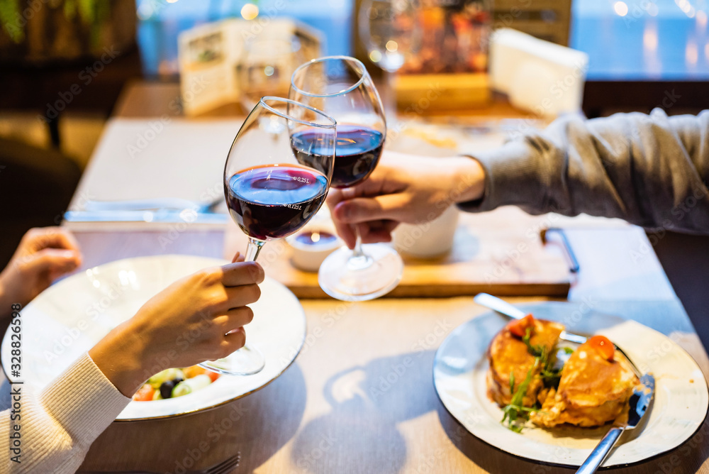Man and woman drinking red wine in the restaurant Man and woman drinking red wine in the restaurant