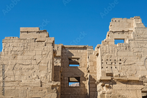 Hieroglyphic carvings on an ancient egyptian temple wall